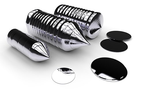 Image of several crystal silicon ingots and the disks that can be sliced from them